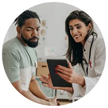 Doctor and patient reviewing MyOme test resources on a tablet