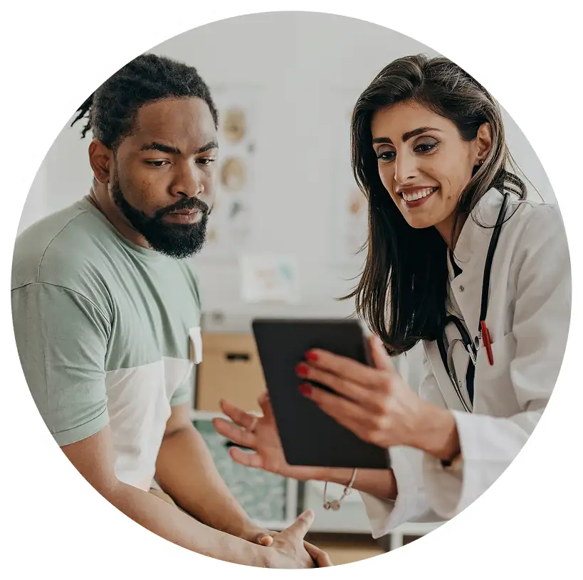 Doctor and patient reviewing MyOme test resources on a tablet