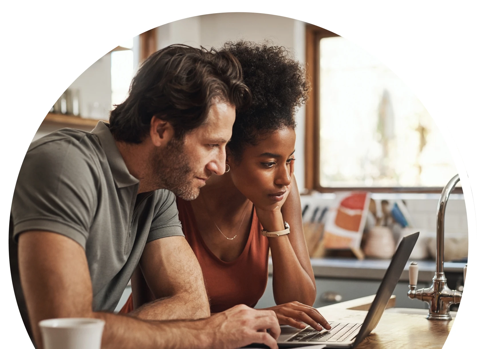 Man and woman looking at a computer screen