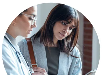 doctor and patient looking at tablet