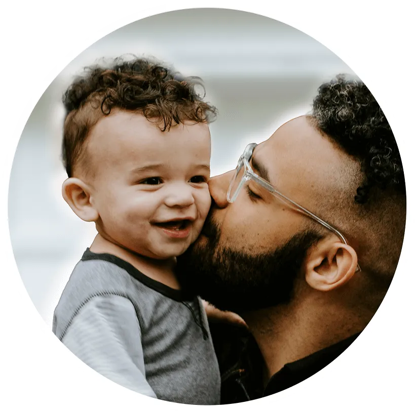 Man kissing a child on the cheek